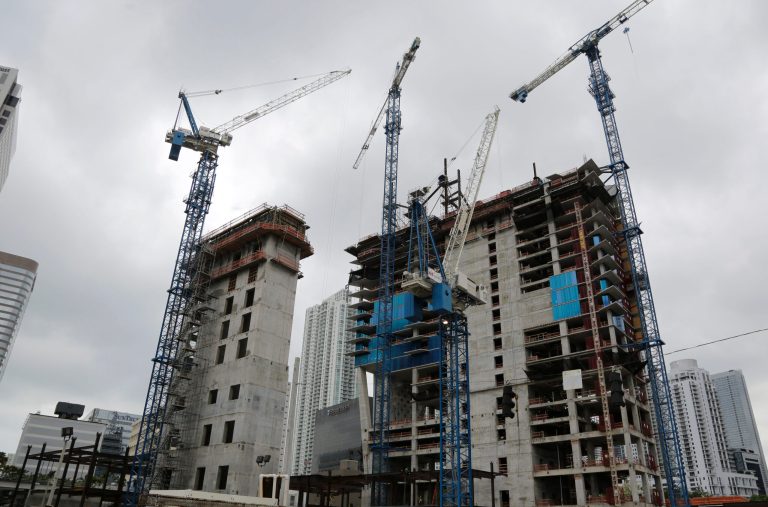 In this Friday, May 16, 2014 photo, cranes fill the skyline at the Brickell CityCentre construction site located in the center of the Brickell financial district in downtown Miami. The project is mixed use office, residential, hotel, retail and entertainment space. The Commerce Department reports on U.S. construction spending in May on Tuesday, July 1, 2014. (AP Photo/Lynne Sladky)
