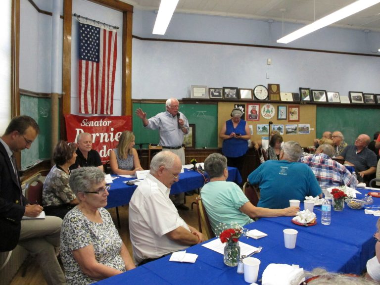 Sen. Bernie Sanders talks with seniors at the Franklin County Senior Center in St. Albans on Aug. 14. Sanders says he will introduce a medicare for all bill shortly after Congress reconvenes in September. (AP Photo/Lisa Rathke)