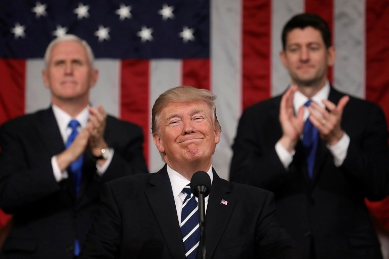 President Donald Trump addresses a joint session of Congress on Capitol Hill in Washington, Tuesday, Feb. 28, 2017, as Vice President Mike Pence and House Speaker Paul Ryan of Wis., applaud. (Jim Lo Scalzo/Pool Image via AP)