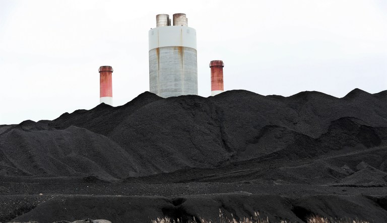 Coal ash is the waste left over from burning coal for electricity production. The waste is typically stored in large containment ponds. (AP Photo/Mark Humphrey)