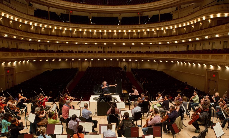 Metropolitan Opera Music Director James Levine conducts the MET Orchestra on May 18, 2013 during a rehearsal at Carnegie Hall. The Sunday, May 19 concert by the MET Orchestra at Carnegie Hall will mark Maestro Levine's first public performance in more than two years after being sideline by a spinal injury. The concert will be broadcast live on SIRIUS XM Channel 74 and streamed on the Met's Web site (metopera.org) beginning at 2:55 p.m. (AP Photo/Metropolitan Opera, Cory Weaver)