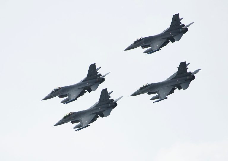 An F-16 fighter squadron fly by during a demonstration on the Lake Ijsselmeer, Netherlands, on June 14, 2013. (Photo by Michel Porro/Getty Images)