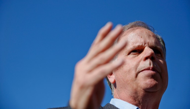 Many of the latest polls show that Doug Jones is leading Roy Moore by significant margins. (AP Photo/Brynn Anderson)