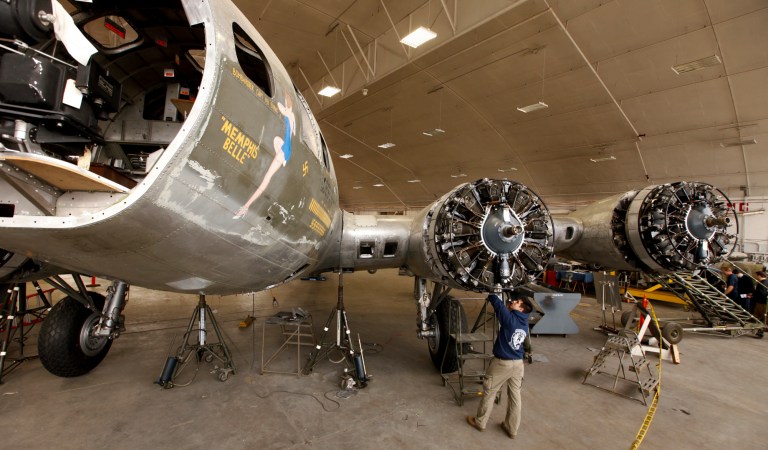   FILE - This Feb. 23, 2012 file photo shows Casey Simmons checking the engine cowl work at the Memphis Belle restoration at the National Museum of the U.S. Air Force in Dayton, Ohio. The most celebrated American aircraft to emerge from the great war rests these days in a cavernous hangar at a southern Ohio Air Force base undergoing a loving and fastidious restoration _ from its clear plastic nose cone down to the twin .50-caliber machine guns bristling in the tail. (AP Photo/The Dayton Daily News, Ty Greenlees)  