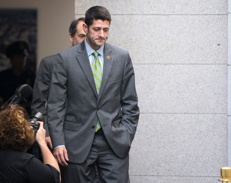 House Budget Committee chairman Rep. Paul Ryan, R-Wis., walks to a meeting with House Republicans on Capitol Hill on Wednesday, Oct. 16, 2013 in Washington. Senate leaders announced last-minute agreement Wednesday to avert a threatened Treasury default and reopen the government after a partial, 16-day shutdown. (AP Photo/ Evan Vucci)