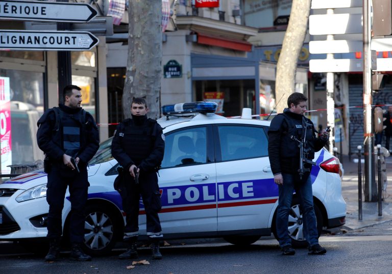Police officers shot and killed a knife-wielding man with wires protruding from his clothes at a police station in northern Paris on Thursday, French officials said. (AP Photo/Christophe Ena)