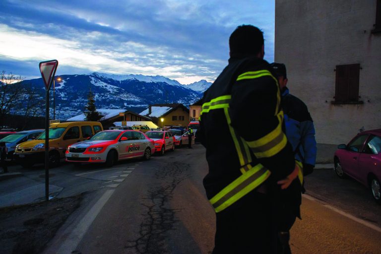 Police patrol in the village of Daillon after a shooting, in Switzerland, early Thursday, Jan. 3, 2013. A man shot and killed three people and wounded another two in a Swiss village, and was then arrested by officers who shot and injured him, police said Thursday. Police in the southern canton (state) of Valais said they were alerted to the shooting in the village of Daillon just before 9 p.m. (20:00GMT) Wednesday. Three of the victims died at the scene and the two injured people were taken to hospitals. A police statement early Thursday gave no detail on their injuries. (AP Photos/Keystone, Olivier Maire)