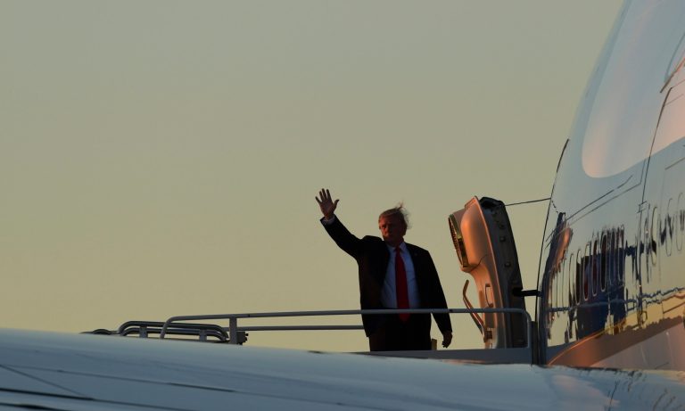 President Donald Trump waves from the top of the steps of Air Force One at Palm Beach International Airport in West Palm Beach, Fla., Sunday, Dec. 10, 2017. Trump spent the weekend at his Mar-a-Lago estate in Palm Beach, Fla., and attended the opening of the Mississippi Civil Rights Museum in Jackson, Miss. (AP Photo/Susan Walsh)