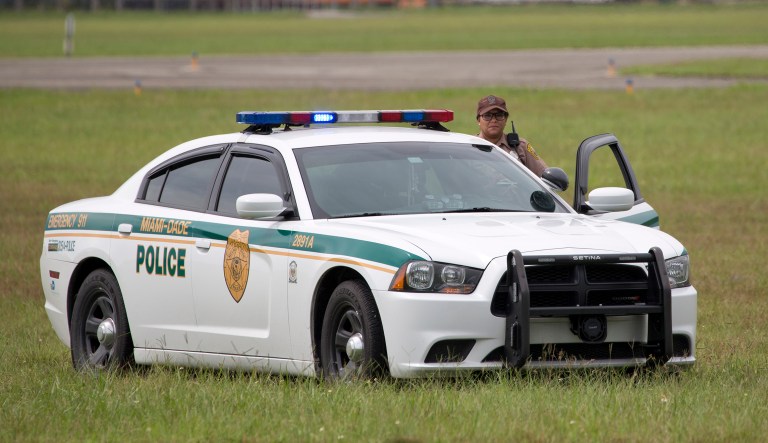 Eighty percent of this year's COPS Hiring Program grantees have agreed to cooperate with federal immigration authorities in their detention facilities. (AP Photo/Wilfredo Lee)
