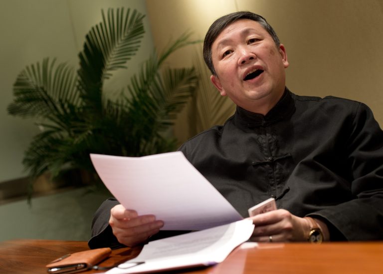   Zhang Lifan, Beijing-based independent scholar, checks his papers as he speaks during an interview in Beijing Wednesday, Dec. 26, 2012. More than 70 prominent Chinese scholars, including Zhang, and lawyers have urged new Communist Party leaders to undertake moderate political reforms including separating the party from government, though they avoid any mention of ending one-party rule. The petition calls on the party to rule according to the constitution, protect freedom of speech, encourage private enterprise and allow an independent judicial system. (AP Photo/Andy Wong)  