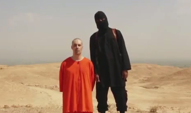 A frame from a video released by Islamic State militants Tuesday that purports to show the killing of journalist James Foley by the militant group. Foley, from Rochester, N.H., went missing in 2012 in northern Syria while on assignment for Agence France-Press and the Boston-based media company GlobalPost. (AP Photo)