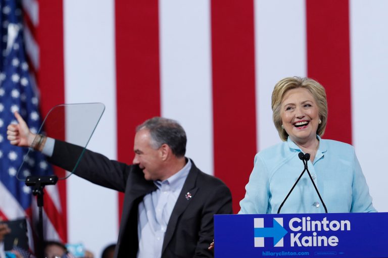 Democratic presidential candidate Hillary Clinton is joined by Sen. Tim Kaine, D-Va., as she speaks during a campaign rally at Florida International University Panther Arena in Miami, Saturday, July 23, 2016. Clinton has chosen Kaine to be her running mate. (AP Photo/Mary Altaffer)