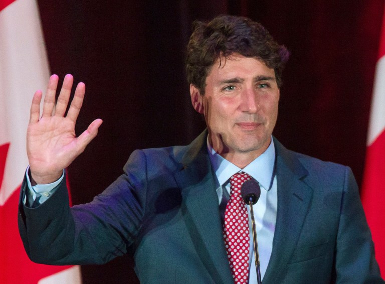 Canadian Prime Minister Justin Trudeau greets to supporters during a Liberal fundraising event in Surrey, British Columbia, Monday, July 31, 2017. (Ben Nelms/The Canadian Press via AP)