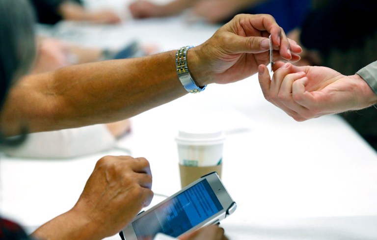 We should be making IDs easier to obtain for hard-case exceptions, not maintaining an honor-system for voting. (AP Photo/Rogelio V. Solis)