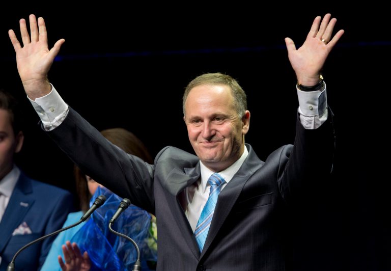 New Zealand Prime Minister John Key waves as he makes a speech after winning the national election in Auckland, New Zealand, Saturday, Sept. 20, 2014. Key won an emphatic victory in New Zealand's general election to return for a third term in office, a result that will be seen as an endorsement of the way Key's National Party has handled the economy. (AP Photo/New Zealand Herald, Mark Mitchell) NEW ZEALAND OUT, AUSTRALIA OUT