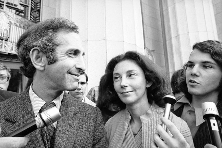 In this Wednesday, April 12, 1973 photo, Daniel Ellsberg, co-defendant in the Pentagon Papers trial, talks with newsmen after he testified in Los Angeles. Next to him is his wife, Patricia. Ellsberg, who vividly described his journey to disillusionment in Vietnam on Wednesday, will climax that story on Thursday, telling jurors how he risked his government career to copy the Pentagon Papers, hoping to end the war. As the last U.S. combat troops left Vietnam 40 years ago, angry protesters still awaited them at home. North Vietnamese soldiers took heart from their foes' departure, and South Vietnamese who had helped the Americans feared for the future. While the fall of Saigon two years later -- with its indelible images of frantic helicopter evacuations -- is remembered as the final day of the Vietnam War, Friday marks an anniversary that holds greater meaning for many who fought, protested or otherwise lived it. (AP Photo)