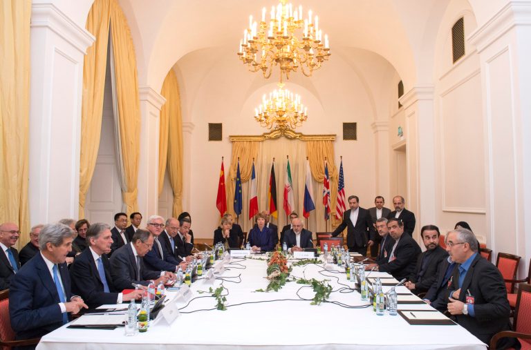 Delegations of US Secretary of State John Kerry, Britain's Foreign Secretary Philip Hammond, Russian Foreign Minister Sergei Lavrov, German Foreign Minister Frank-Walter Steinmeier, French Foreign Minister Laurent Fabius, Chinese Foreign Minister Wang Yi, , left side from left, Iranian Foreign Minister Mohammad Javad Zarif, center right, and former EU foreign pilicy chief Catherine Ashton, center, sit around the negotiations table during their talks on Iran, in Vienna, Austria, Monday. (AP/Joe Klamar)