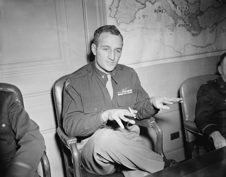 Lieut. Tom Harmon, former All-America football player at the University of Michigan, tells of combat experience at a press conference in Washington, D.C., January 1944, upon return from 11 months of duty in North Africa and China, as a U.S. Army Air Force fighter pilot. (AP Photo)