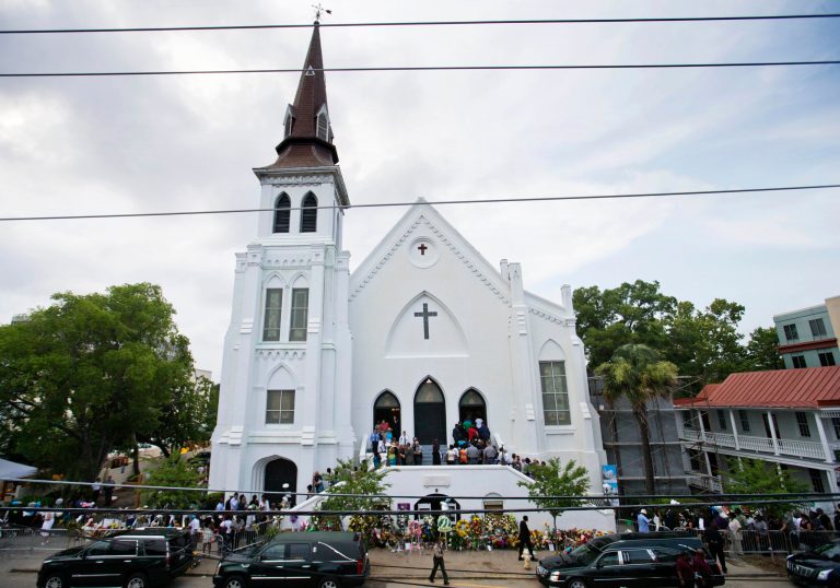 People line up to attend the wake of Sen. Clementa Pinckney, one of the nine killed in a shooting, at Emanuel AME Church, Thursday, June 25, 2015, in Charleston, S.C. President Obama will deliver the eulogy at Pinckney's funeral Friday at a nearby college arena. (AP Photo/David Goldman)