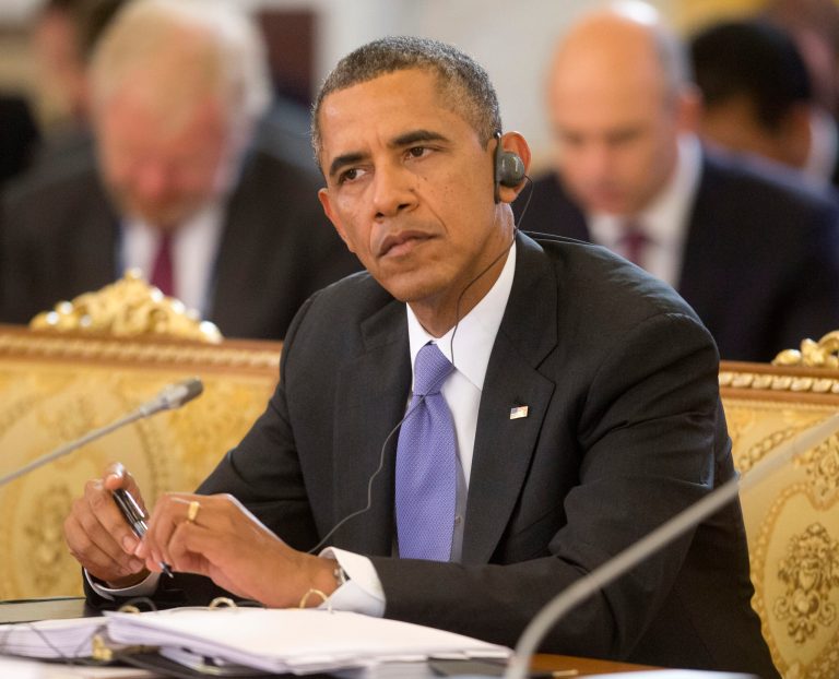 President Barack Obama listens as Russian President Vladimir Putin speaks during the start of the G-20 Working Session at the Konstantin Palace in St. Petersburg, Russia, Thursday, Sept. 5, 2013. (AP Photo/Pablo Martinez Monsivais/Pool)