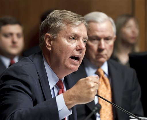 Senate Judiciary Committee member Sen. Jeff Sessions looks on at right asSen. Lindsey Graham questions Attorney General Eric Holder  earlier this month. Graham circulated a letter Tuesday to push for a special prosecutor to investigate leaks. (AP Photo/J. Scott Applewhite)