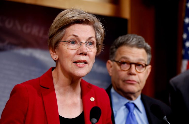 FILE - In this March 25, 2015 file photo, Sen. Elizabeth Warren, D-Mass, left, speaks at a new conference on Capitol Hill in Washington. Sen. Al Franken, D-Minn. is at right. (AP Photo/Andrew Harnik, File)