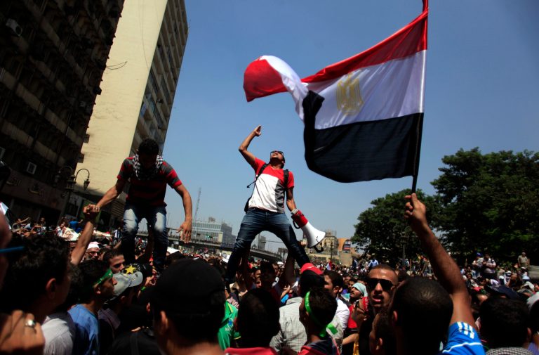 Supporters of Egypt's ousted President Mohammed Morsi chant slogans during a protest in Ramses Square in downtown Cairo on Friday. (AP/Khalil Hamra)