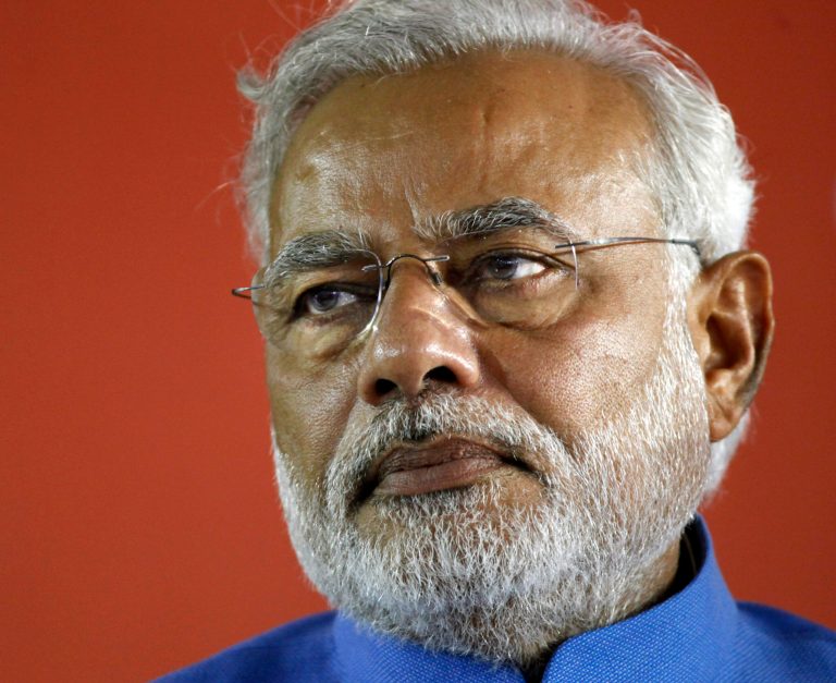 FILE - In this May 17, 2014 file photo, then-India's next Prime Minister Narendra Modi attends a press conference at the party headquarters in New Delhi, India. Police in southern India arrested seven people, including four students, and charged them with defaming the country's new Prime Minister Modi in a college magazine, officials said Friday, June 13, 2014. The arrests came after an annual student magazine at the Government Polytechnic College in Kerala state included a photo of Modi in a collage of what it called 