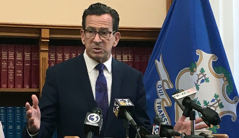 On Friday, Connecticut Gov. Dan Malloy raised the flag of Haiti at the Governor's Residence, saying in a tweet that it was meant to commemorate the eight-year anniversary of the Haiti earthquake and serve as a response to President Trump's comments about the nation. (AP Photo/Susan Haigh)