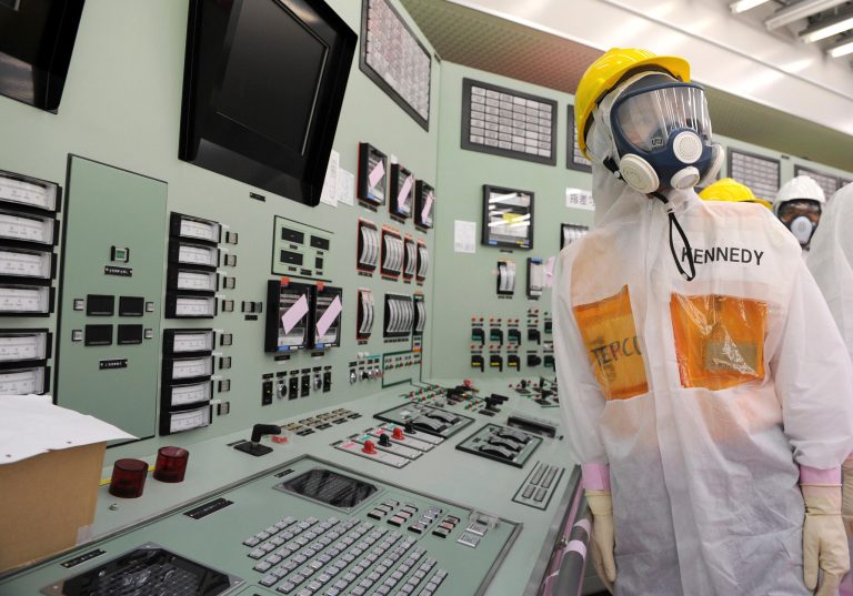 U.S. Ambassador to Japan Caroline Kennedy wearing a yellow helmet, a protective suit and a mask, inspects the central control room for the Unit One and Unit Two reactors of the tsunami-crippled Fukushima Dai-ichi nuclear power plant, operated by Japan's Tokyo Electric Power Co. (TEPCO), in Okuma, Fukushima Prefecture, northeastern Japan, Wednesday, May 14, 2014. Kennedy toured the Fukushima Dai-ichi plant for about three hours Wednesday. (AP Photo/Toru Yamanaka, Pool)