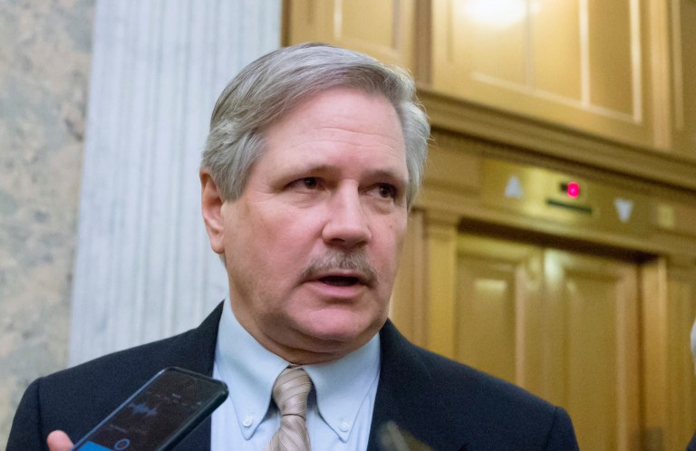 Measure that requires everyone to buy insurance or pay a fine could stick around for a few years as part of a transition, Sen. John Hoeven said. (AP Photo/J. Scott Applewhite, File)