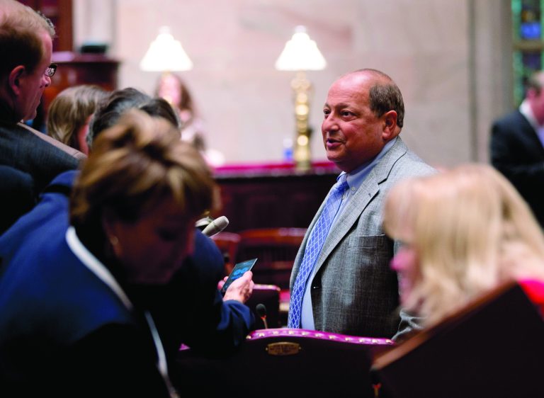 Deputy Senate Majority Leader Thomas Libous, R-Binghamton, talks to reporters on the Senate floor before session on Monday, Jan. 14, 2013, in Albany, N.Y. People familiar with the internal negotiations say New York Gov. Andrew Cuomo and legislative leaders have a tentative deal to enact the nation's first gun control measure following the Newtown, Conn., school shooting. (AP Photo/Mike Groll)
