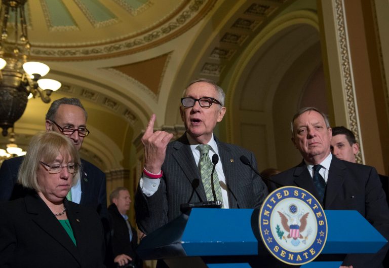 Senate Minority Leader Harry Reid and other Democrats hold a press conference on Capitol Hill in Washington, Tuesday, March 17, 2015. (AP Photo/Molly Riley)