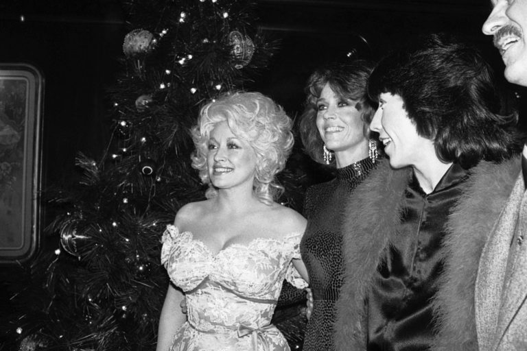 Dolly Parton, left, gestures as she chats with Jane Fonda, center and Lily Tomlin on Sunday, Dec. 15, 1980 in New York at a party following the premiere of the movie 