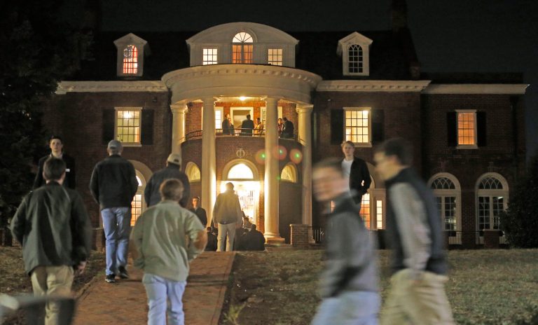 In this Thursday, Jan. 15, 2015 photo, University of Virginia students walk to fraternities at the start of rush week at the University of Virginia in Charlottesville, Va. (AP Photo/Steve Helber)