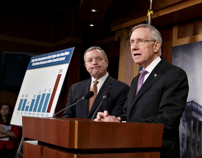 Senate Majority Leader Harry Reid, D-Nev., center, joined Majority Whip Dick Durbin, D-Ill., talks to reporters about a measure to extend jobless benefits, at the Capitol in Washington on Dec. 19. (AP Photo/J. Scott Applewhite)