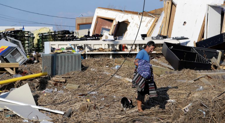 Bob Campbell walks through debris after returning home after Hurricane Harvey on Wednesday in Port Aransas, Texas. Next week, lawmakers will take up legislation that would provide billions of dollars in relief funding as Texas and Louisiana. (AP Photo/Eric Gay)