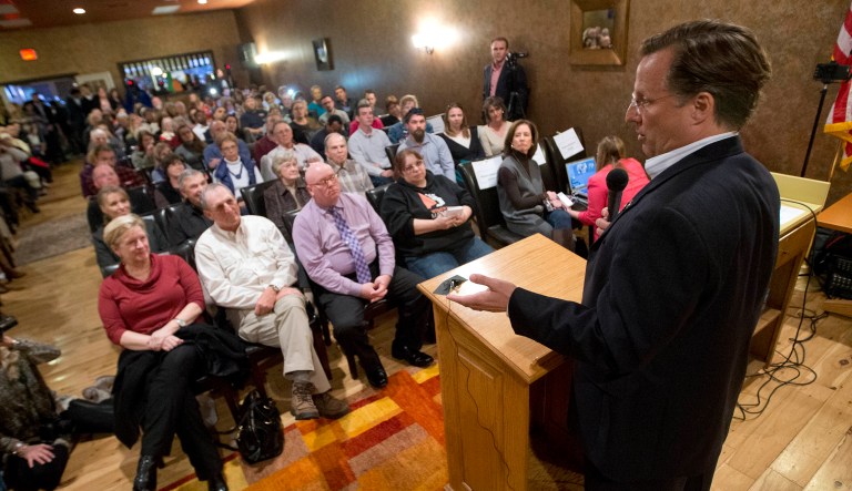 Congressman Dave Brat, R-Va., answers a question during a town hall meeting. Town halls have become even more contentious since the House passed their bill to repeal and replace Obamacare -- so lawmakers are avoiding them. (AP Photo/Steve Helber)
