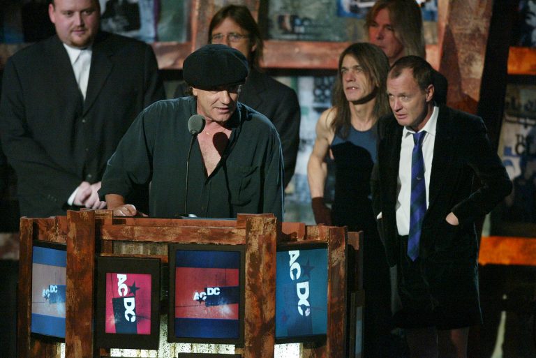 AC/DC at the18th Rock and Roll Hall of Fame induction ceremony at the Waldorf-Astoria Hotel on March 10, 2003 in New York City. AC/DC was inducted into the Hall of Fame along with The Righteous Brothers, Mo Ostin, The Clash and The Police. (Photo by Frank Micelotta/Getty Images)