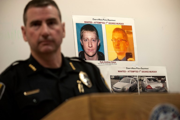 Coeur d'Alene Police Chief Lee White speaks during a news conference Monday, March 7, 2016, with a photo of Kyle Andrew Odom in the background in Coeur D'Alene, Idaho. (Kathy Plonka/The Spokesman-Review, via AP)