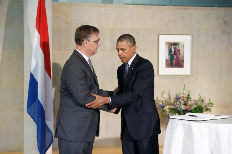 President Barack Obama visits the Dutch Embassy in Washington to sign a book of condolence, joined by Deputy Chief of Mission Peter Mollema, Tuesday, July 22, 2014. Most of the 298 people aboard the Malaysia Airlines plane that was shot down near the border between Ukraine and Russia were Dutch citizens. (AP Photo/J. Scott Applewhite)