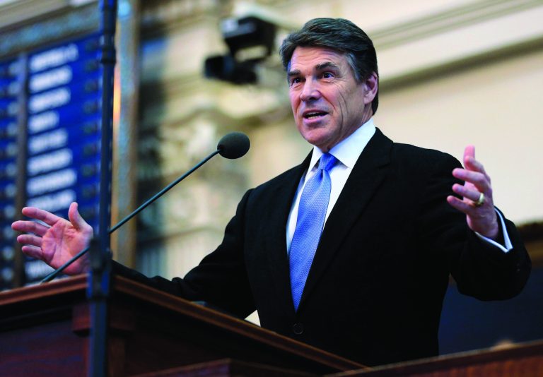File-In a Jan. 8, 2013 file photo Texas Gov. Rick Perry addresses the opening session of the 83rd Texas Legislature in Austin, Texas. Perry began his latest visit to California on a quest to lure businesses to move jobs to his state by promoting low taxes and lax regulations. The former Republican presidential candidate began meeting with business leaders in the San Francisco Bay area on Monday Feb. 11, 2013. (AP Photo/Eric Gay,File)
