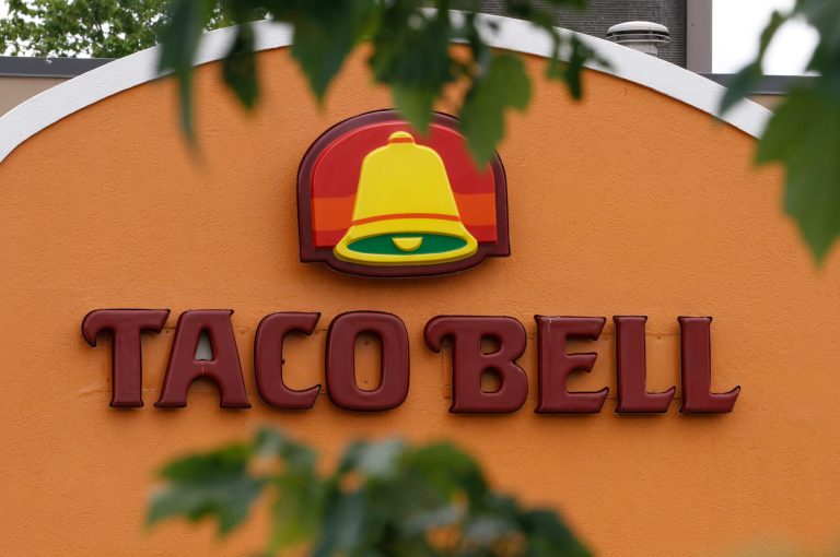 FILE-This Wednesday, June 6, 2012, file photo shows a Taco Bell restaurant in Richmond, Va. Taco Bell is testing a new menu featuring items made with Sriracha, looking to tap into the cult following for the red Thai hot sauce. (AP Photo/Steve Helber, File)