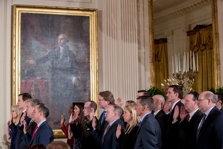 From left, President Donald Trump's advisors Kellyanne Conway, Jared Kushner, Steve Bannon, and Trump Chief of Staff Reince Priebus, and other members of White House senior staff are sworn in during a ceremony in the East Room of the White House, Sunday, Jan. 22, 2017, in Washington. (AP Photo/Andrew Harnik)