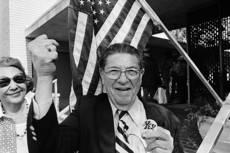 Howard Jarvis, co-sponsor of Proposition 13, the property tax limitation initiative, holds a 