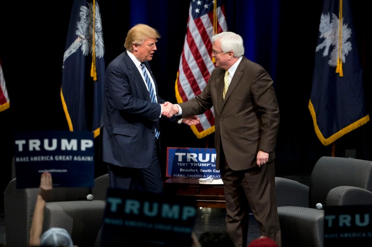 Then-candidate Trump, left, shakes hands with Van Hipp during a campaign stop in Beaufort, S.C. Hipp is withdrawing his name from consideration for the Army secretary post saying, 