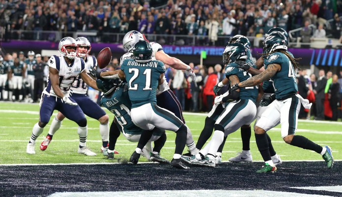Philadelphia Eagles cornerback reaches out to pull in a pass intended for New England Patriots tight end on the last play of the game in Super Bowl LII in Minneapolis. The Eagles defeated the Patriots 41-33 to win their first Super Bowl. (AP Photo/Doug Benc)