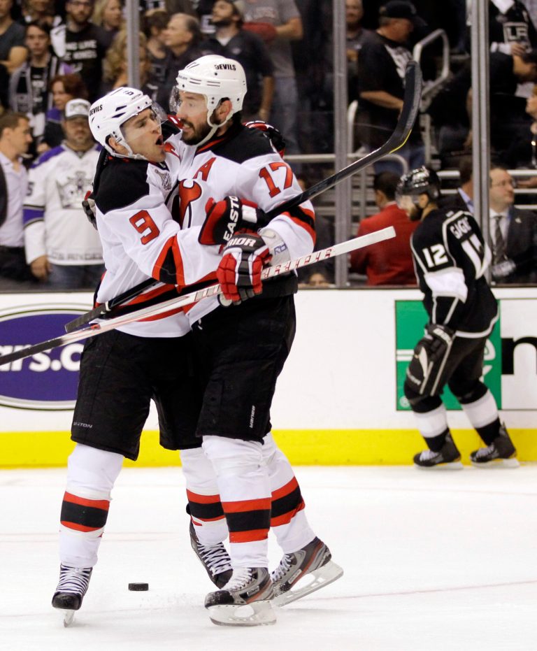  New Jersey Devils' Zach Parise (9)celebrates with Ilya Kovalchuk, of Russia, after Kovalchuk, scored an open net goal in the third period during Game 4 of the NHL hockey Stanley Cup finals, Wednesday, June 6, 2012, in Los Angeles. Los Angeles Kings' Simon Gagne skated past in background. The Devils won the game 3-1. (AP Photo/Julie Jacobson)  