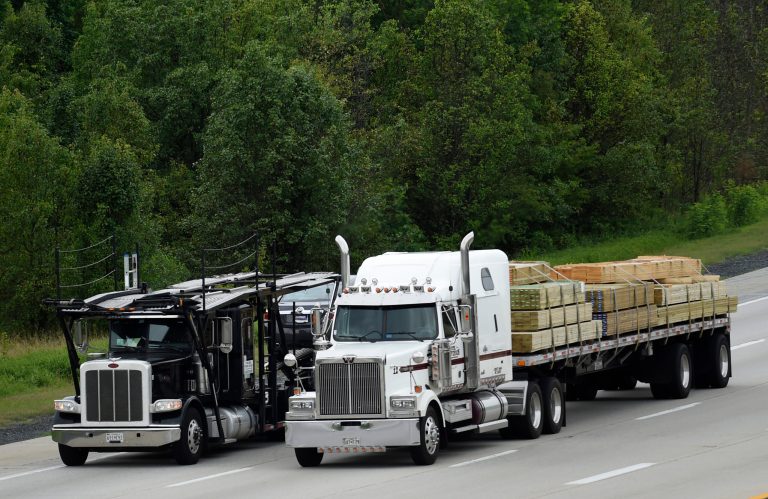 Trucks head eastbound on Rt 50 in Bowie, Md., Friday, June 19, 2015. The Obama administration on Friday proposed tougher mileage standards for medium and heavy-duty trucks, the latest move by President Barack Obama in his second-term drive to reduce pollution blamed for global warming. (AP Photo/Susan Walsh)