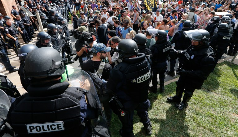 Law enforcement needs to approach such situations with a clear plan that discourages confrontation and does not rely on hopes that eventually both sides will simply disperse. (AP Photo/Steve Helber)